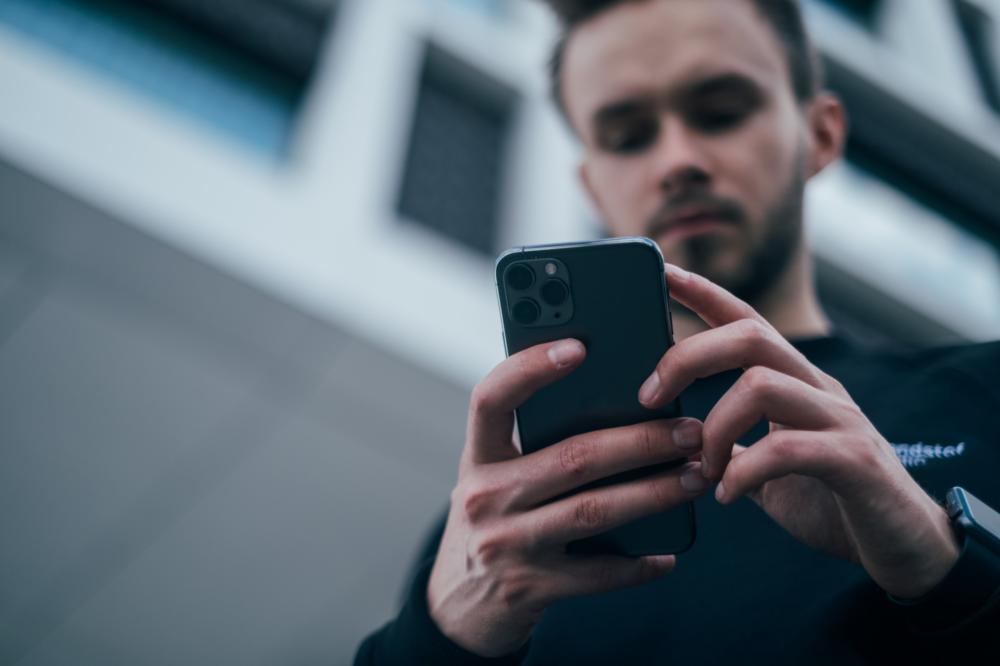 Person reading on their phone.