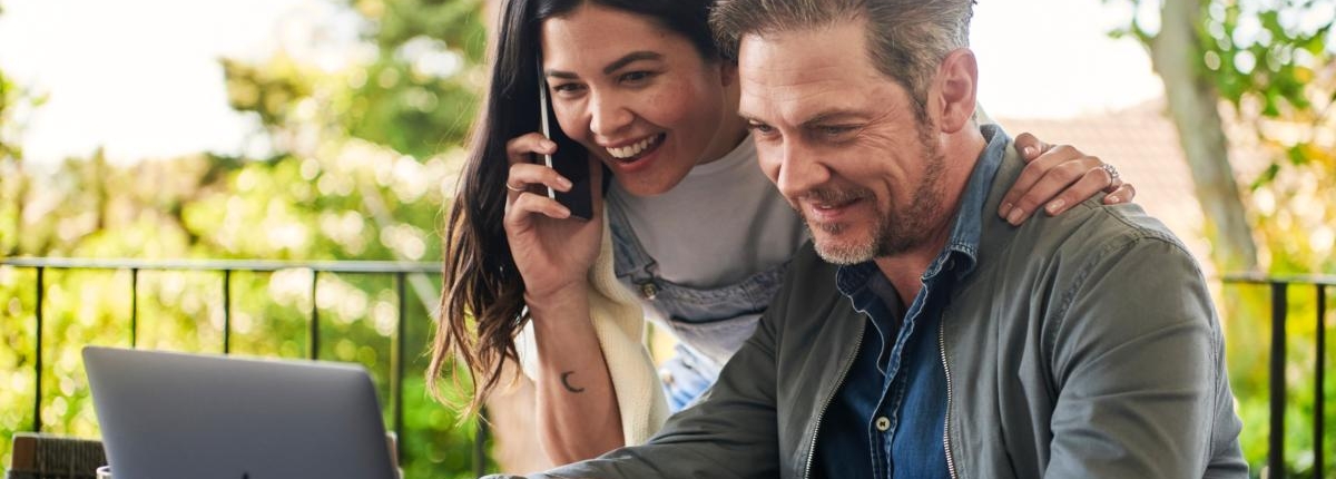 Woman and man looking at laptop