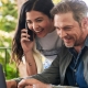 Woman and man looking at laptop