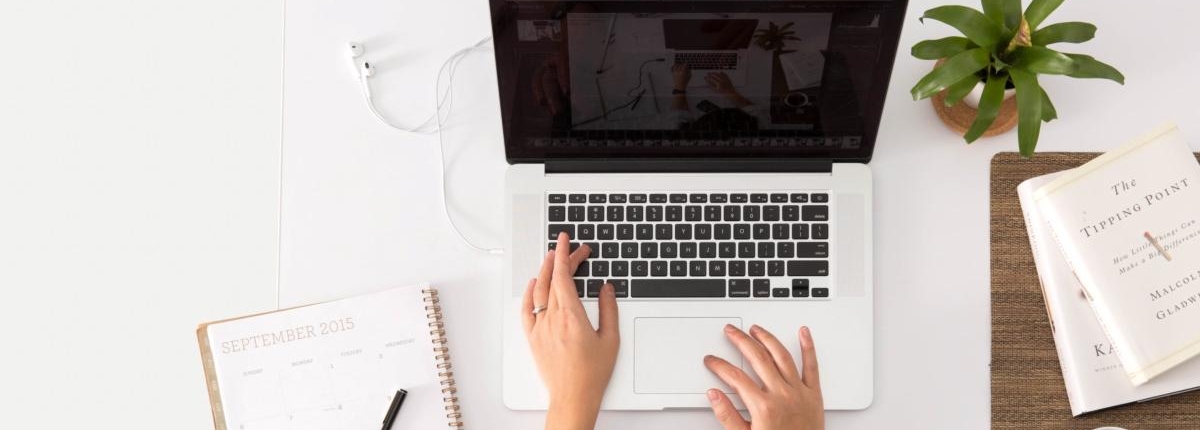 Woman typing on a laptop