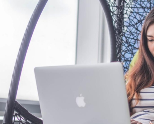 Woman looking at laptop