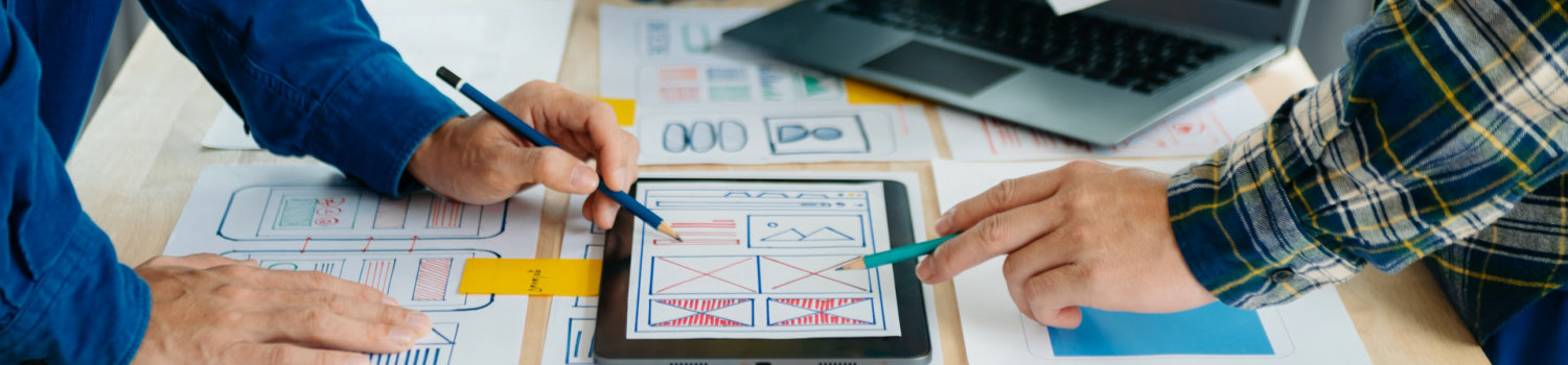 UX developer and ui designer brainstorming about mobile app int