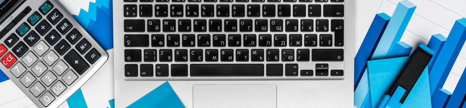 Top view of table with financial papers and calculator